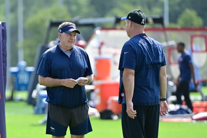 Jul 26, 2023; Foxborough, MA, USA; New England Patriots head coach Bill Belichick speaks to offensive coordinator/quarterbacks coach Bill O'Brien during training camp at Gillette Stadium.